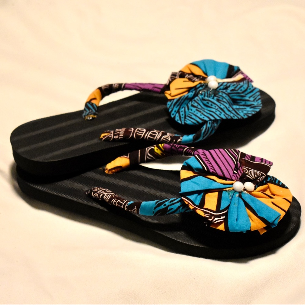 Handmade African print slippers .
